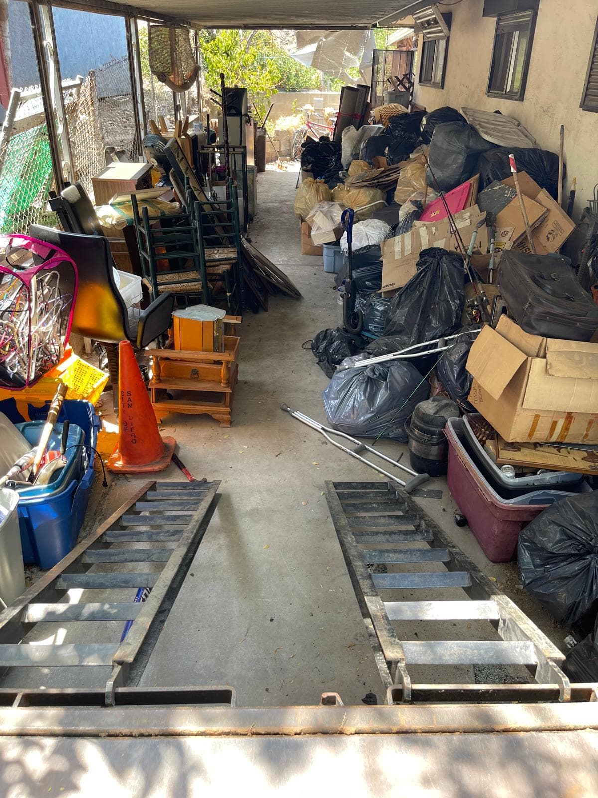 Residential cleanout prepared for hauling by NEXT Junk Removal